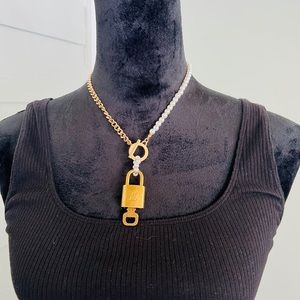 Louis Vuitton lock and key on a chain